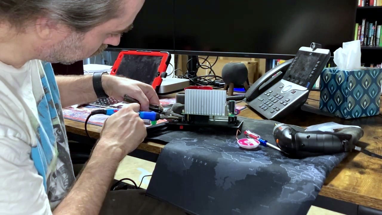 Soldering new capacitors onto the amplifier board