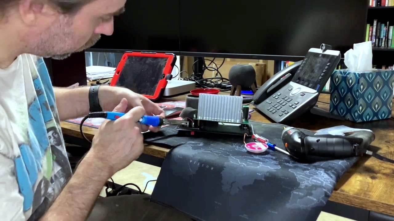 Desoldering the old capacitors from the amplifier board