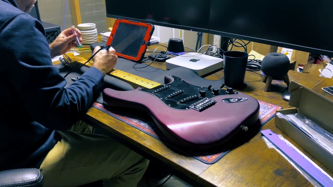 Heating a fret with a soldering gun before pulling it